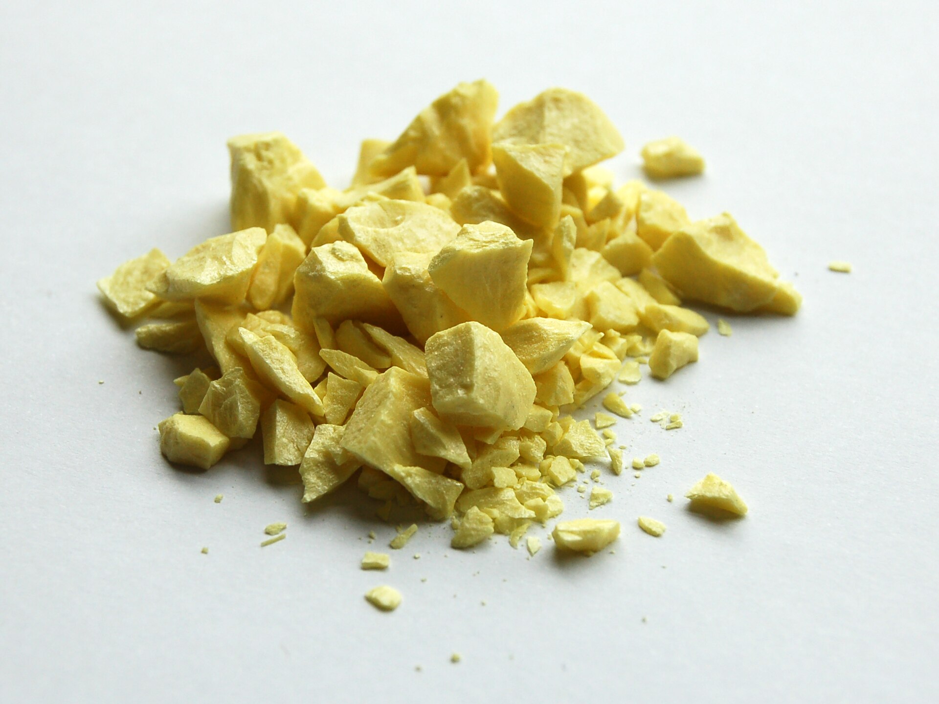 Native sulfur. Recovered elemental sulfur from sour gas and oil sands is the same yellow element in formed tonnes.
